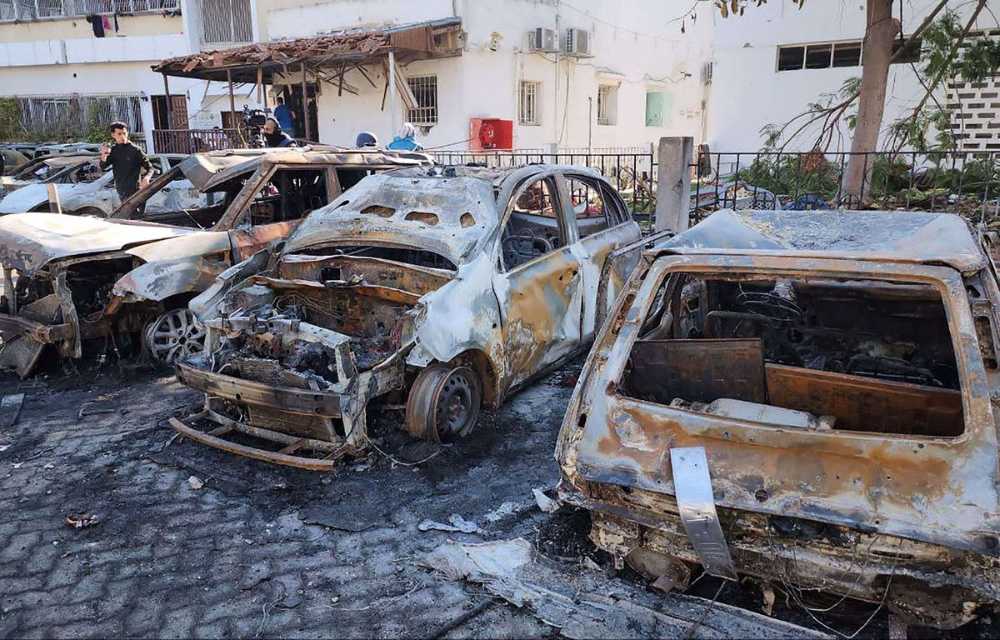 1200x768_mandatory-credit-photo-by-muthana-alnajjar-upi-shutterstock-14155746f-burnt-cars-are-seen-at-the-site-of-the-al-ahli-baptist-hospital-in-central-gaza-city-on-wednesday-october-18-2023-in-the-
